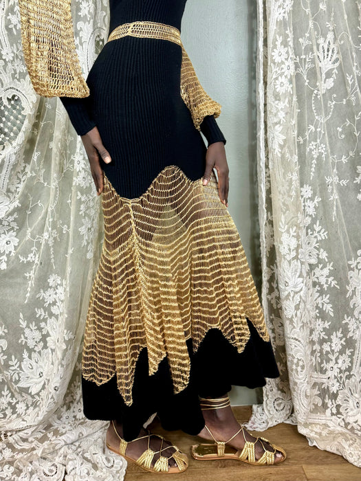 Alexander McQueen, black knit and gold net dress